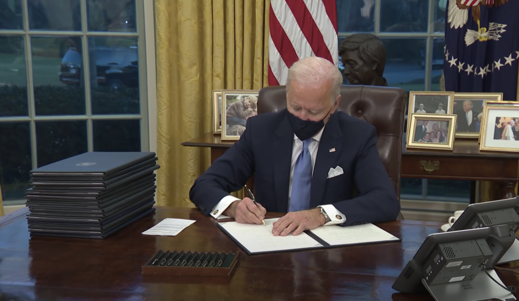 President Joe Biden signing executive orders