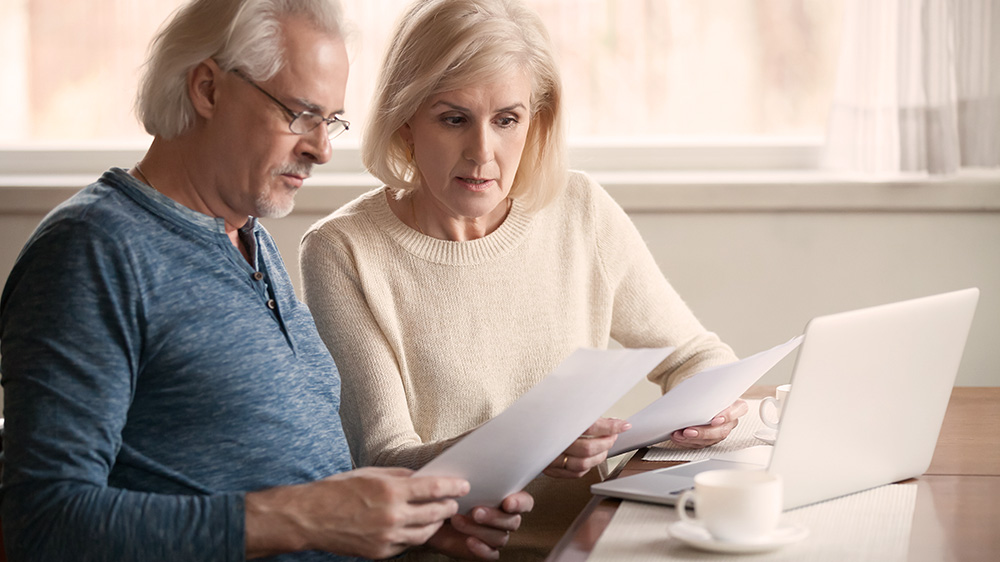 Man and woman reviewing their retirement plan