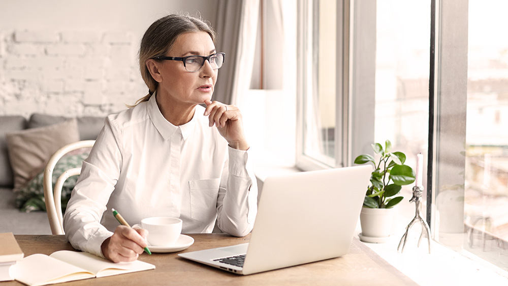 A woman wondering if she has saved enough for retirement