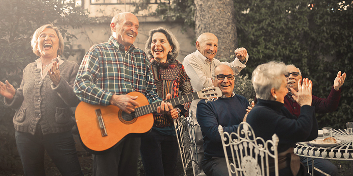 a group of old friends singing, dancing, and playing guitar together